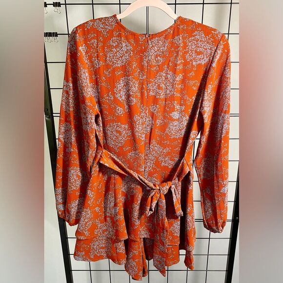 Unbranded women’s floral long sleeve rust colored romper NWOT - Picture 2 of 10